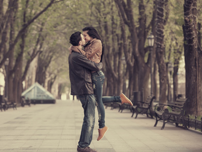 Couple at alley in city.