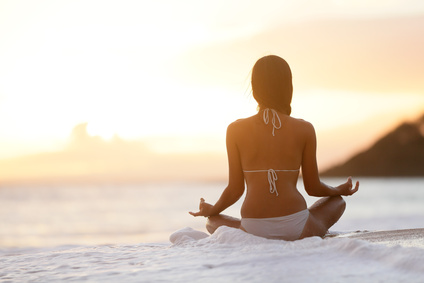 Meditation - Yoga woman meditating at beach sunset