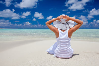 Caucasian woman rests at beautiful seashore ()