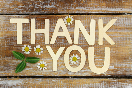 Thank you written with wooden letters on rustic wooden surface