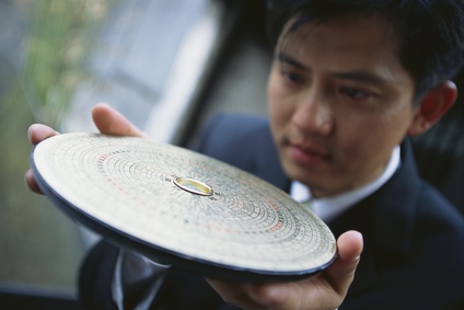 Businessman with Feng Shui Compass
